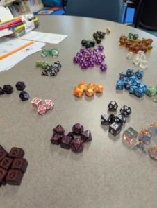 close up of multiple sets of polyhedral dice