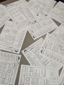 D&D character sheets spread out over a table
